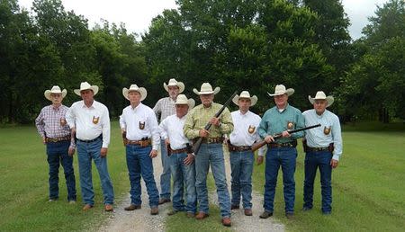 Colonel Jerry Flowers (center and with firearm) stands with agents of the Investigative Services Unit of the Oklahoma Department of Agriculture, Food, and Forestry (ODAFF) Division in this undated handout photo courtesy Jerry Flowers from the ODAFF. REUTERS/ODAFF/Handout via Reuters