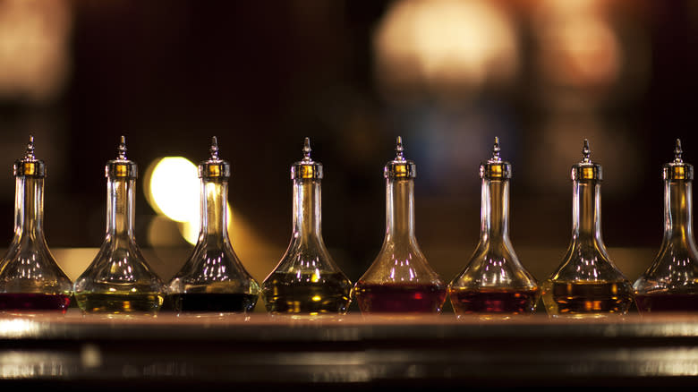row of cocktail bitters bottles