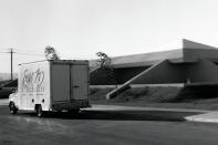 In this undated image provided by Ethel M Chocolates, a delivery truck is seen outside the Ethel M Chocolates building in Henderson, Nev. NASCAR driver Kyle Busch first went to the Ethel M candy factory with his grandmother. It wasn’t a tourist stop to the young Busch, it was a candy store and his grandmother let him roam the cactus garden and rewarded him with the craft chocolates. It comes full circle Sunday at home track Las Vegas Motor Speedway. Ethel M is part of the Mars Corp., the longtime sponsor of Busch’s team. Busch will feature the brand on his car in Sunday’s race. (Ethel M Chocolates via AP)