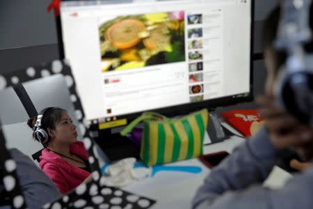 A reporter works in the Democratic Voice of Burma (DVB) news room in Yangon, Myanmar June 29, 2017. REUTERS/Soe Zeya Tun