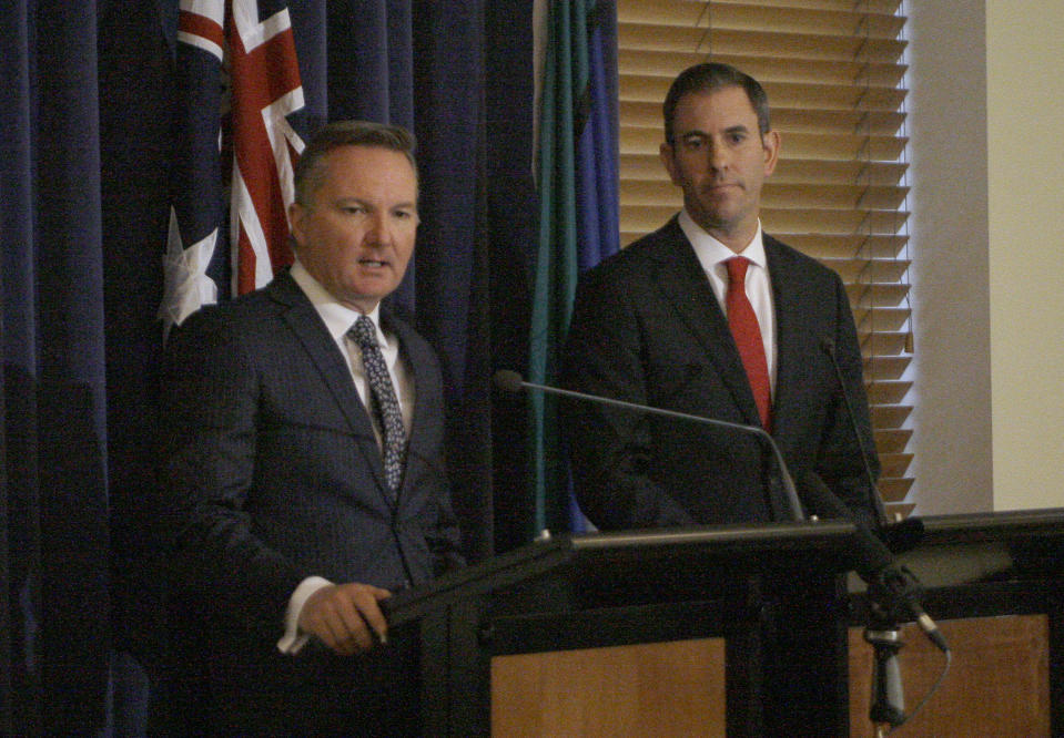 Opposition center-left Labor Party lawmakers Chris Bowen, left, and Jim Chalmers on Friday, May 10, 2019, outline in Parliament House in Canberra, Australia, policy to reduce tax breaks for landlords and some shareholders which they argue would save 154 billion Australian dollars ($108 million) over the next decade. Australia's opposition party has promised to deliver bigger budget surpluses than the government if it wins elections next week, while the ruling coalition warns the policies would harm the economy. (AP Photo/Rod McGuirk)