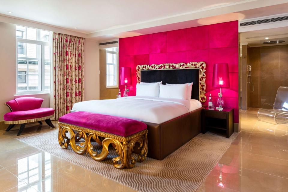 <p>This five-star hotel, set in one of London's most iconic neighbourhoods, has an incredible hot pink suite. Named the Schiaparelli Suite (after fashion designer Elsa Schiaparelli), it has been decorated with pink <a href="https://www.housebeautiful.com/uk/decorate/living-room/g35838996/living-room-wallpaper-ideas/" rel="nofollow noopener" target="_blank" data-ylk="slk:wallpaper;elm:context_link;itc:0;sec:content-canvas" class="link ">wallpaper</a>, matching lampshades and a pink velvet ottoman. It certainly oozes elegance from every nook and cranny.</p><p><a class="link " href="https://uk.hotels.com/ho106180/the-may-fair-a-radisson-collection-hotel-mayfair-london-london-united-kingdom/" rel="nofollow noopener" target="_blank" data-ylk="slk:BOOK NOW VIA HOTELS.COM;elm:context_link;itc:0;sec:content-canvas">BOOK NOW VIA HOTELS.COM</a> </p>