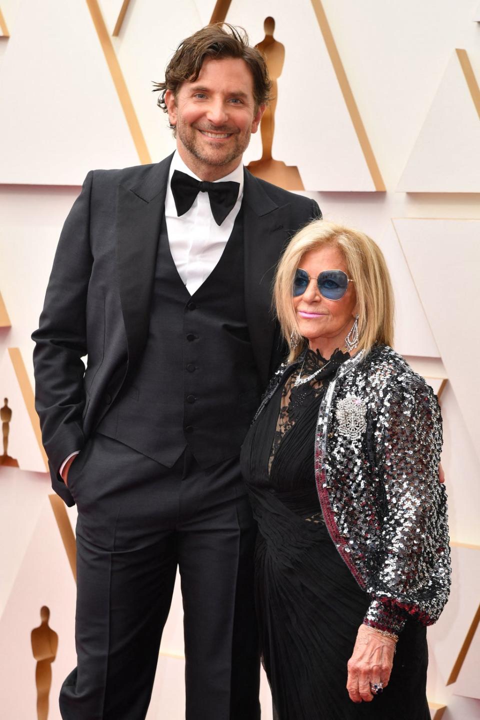 Bradley Cooper attends the Oscars 2022 with his mom, Gloria Campano (AFP via Getty Images)