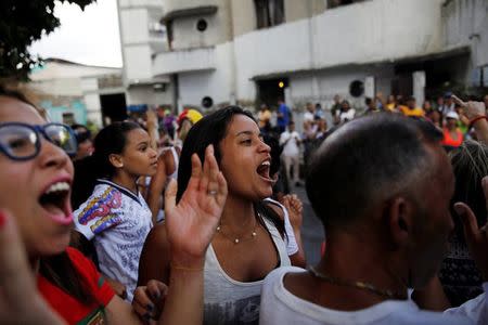 REFILE - QUALITY REPEAT People chant slogans against Venezuela's President Nicolas Maduro while lining up at a polling station during an unofficial plebiscite against Maduro's government and his plan to rewrite the constitution, in Caracas, Venezuela July 16, 2017. REUTERS/Carlos Garcia Rawlins