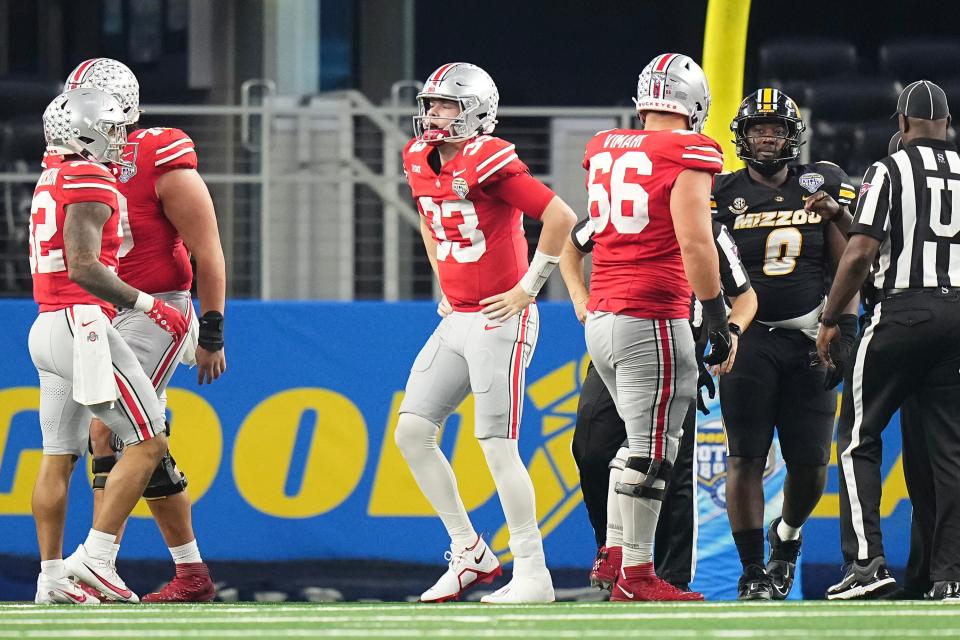 Dec 29, 2023; Arlington, Texas, USA; Ohio State Buckeyes quarterback Devin Brown (33) limps off the field during the second quarter of the Goodyear Cotton Bowl Classic against the Missouri Tigers at AT&T Stadium.