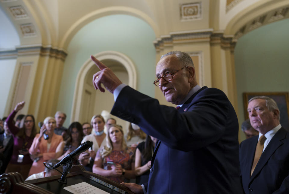 Senate Majority Leader Chuck Schumer, D-N.Y., calls on reporters as he talks about his plans for a procedural vote tomorrow on the bipartisan infrastructure deal senators brokered with President Joe Biden, at the Capitol in Washington, Tuesday, July 20, 2021. (AP Photo/J. Scott Applewhite)