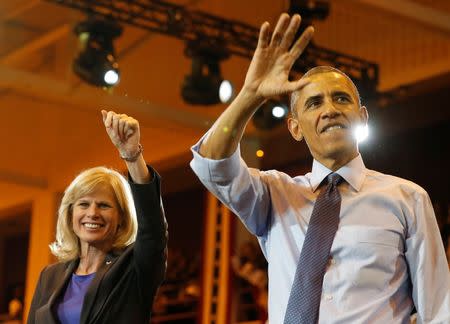 U.S. President Barack Obama attends a campaign event with Democratic candidate for Wisconsin Gov. Mary Burke while at North Division High School in Milwaukee, October 28, 2014. REUTERS/Larry Downing