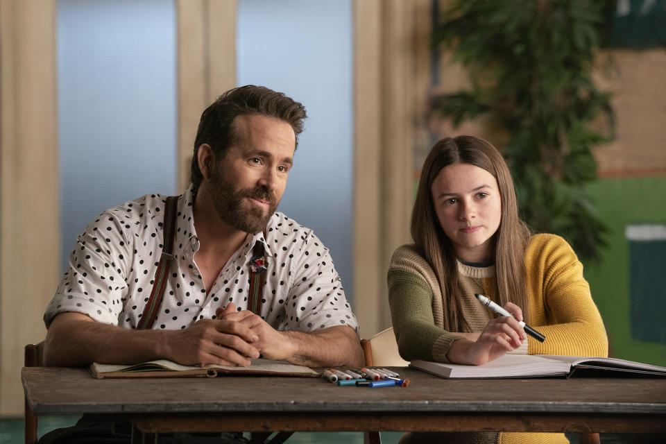 This image released by Paramount Pictures shows Cailey Fleming, right, and Ryan Reynolds in a scene from "IF." (Jonny Cournoyer/Paramount Pictures via AP)