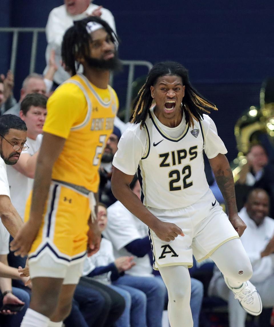Akron Zips guard Mikal Dawson celebrates after a second-half, corner 3-pointer against Kent State, Friday, Feb. 23, 2024.