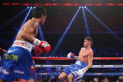 Manny Pacquiao knocks down Chris Algieri Saturday. (Photo by Chris Hyde/Getty Images)