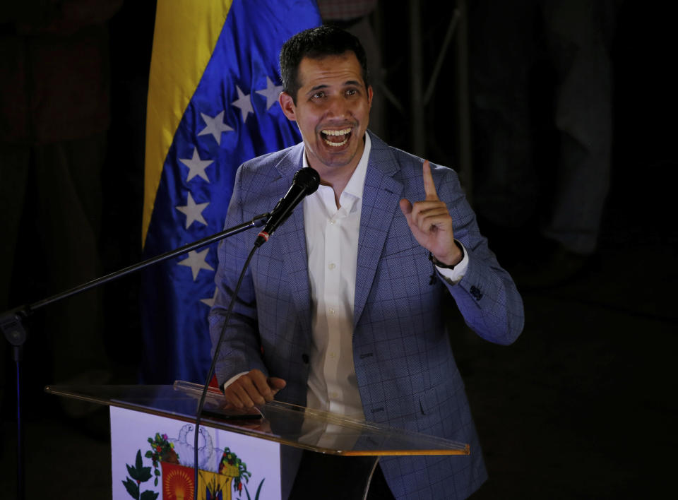 National Assembly President Juan Guaido, delivers a speech during a meeting with residents in the Hatillo municipality of Caracas, Venezuela, Thursday, March 14, 2019. Guaido has declared himself interim president and demands new elections, arguing that President Nicolas Maduro's re-election last year was invalid. (AP Photo/Fernando Llano)