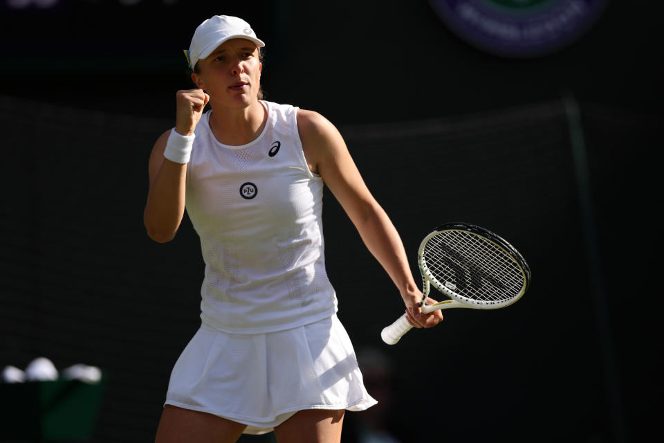 LONDON, ENGLAND - JUNE 30: Iga Swiatek of Poland celebrates a point against Lesley Pattinama Kerkhove of Netherlands during their Women's Singles Second Round match on day four of The Championships Wimbledon 2022 at All England Lawn Tennis and Croquet Club on June 30, 2022 in London, England. (Photo by Clive Brunskill/Getty Images)