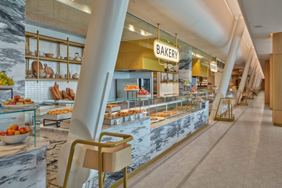 Mosaic tiles, marble counters in the lounge's Market dining area pay tribute to famed New York bars. The penny-round ceiling over the food counter is a hat-tip to the original JFK terminal, designed by famed architect Eero Saarinen.