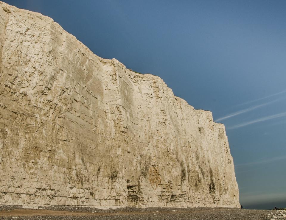 Birling Gap, Eastbourne, East Sussex, UK. 9th May, 2024. The chalk cliffs at this point are some 200ft high rising to over 500ft at Beachy Head. Note the fissures & undercutting just beneath the soil & grass cover, making it invisible from above, top mid section this picture. The cliffs are most unstable with regular rockfalls. It is not safe to be near the edge & the weight of a person or child could immediately trigger a fall. Credit: David Burr/Alamy Live News
