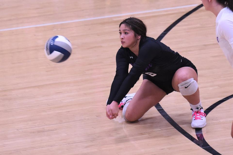 Wylie's Kat Martinez (8) drops to a knee for a dig during the Region I-5A quarterfinal against Canyon Randall at Lubbock Coronado's gym on Nov. 9.