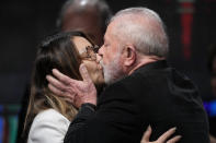 Former Brazilian President Luiz Inacio Lula da Silva, who is running for president again, kisses his wife Rosangela Silva after general election polls closed in in Sao Paulo, Brazil, Sunday, Oct. 2, 2022. (AP Photo/Andre Penner)