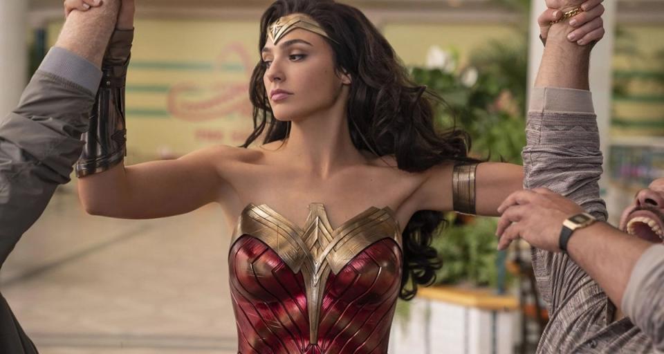 Gal Gadot holds back to criminals arms in Wonder Woman 1984