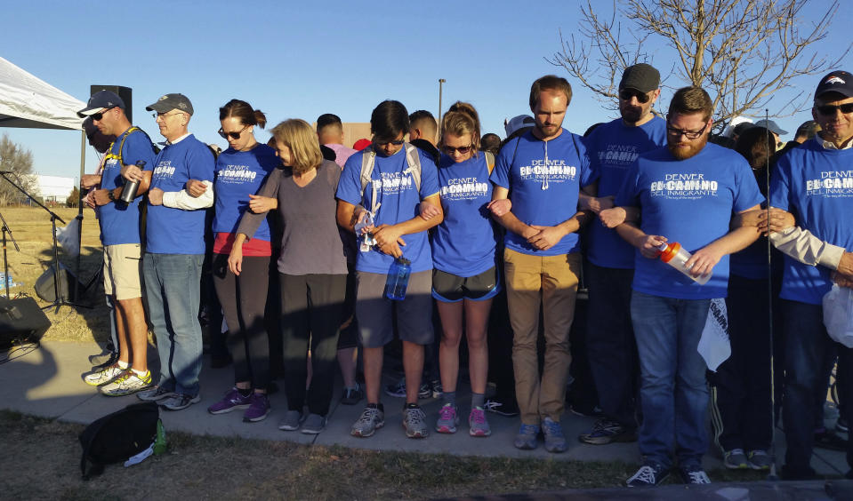 In 2016, supporters link arms around a group of Hispanic demonstrators at the Immigration and Customs Enforcement detention center in Aurora, Colo., after an 11-mile prayer walk to show solidarity with immigrants. (Photo: Steven K. Paulson/AP)