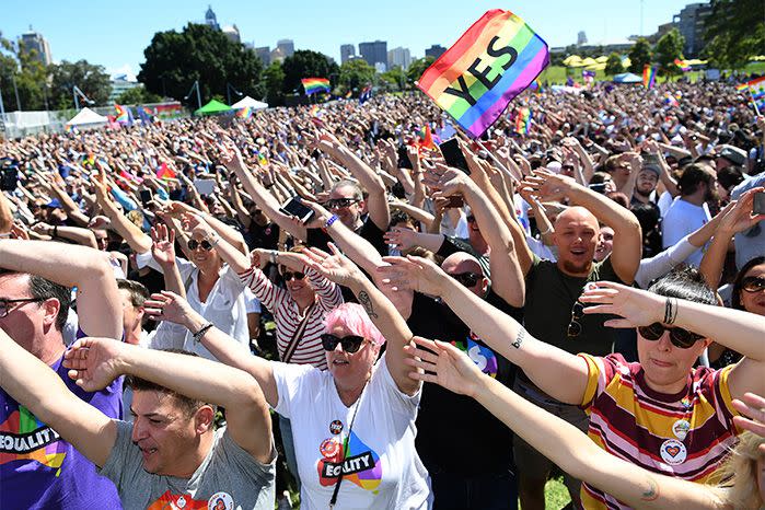 Cheers erupted in Sydney after learning 61.6 per cent of postal vote participants said the law should be changed. Source: AAP