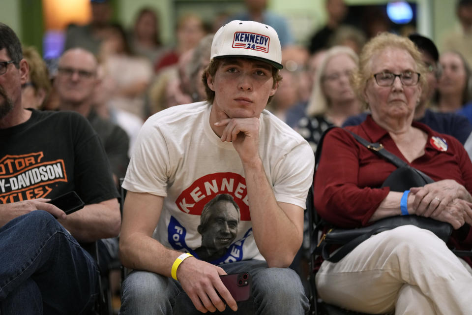 Audience members listen to Independent presidential candidate Robert F. Kennedy Jr. speak during a campaign event, Saturday, April 13, 2024, in West Des Moines, Iowa. (AP Photo/Charlie Neibergall)