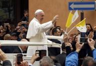 Pope Francis waves as he leaves after a Holy Mass in Carpi, Italy, April 2, 2017. REUTERS/Alessandro Garofalo