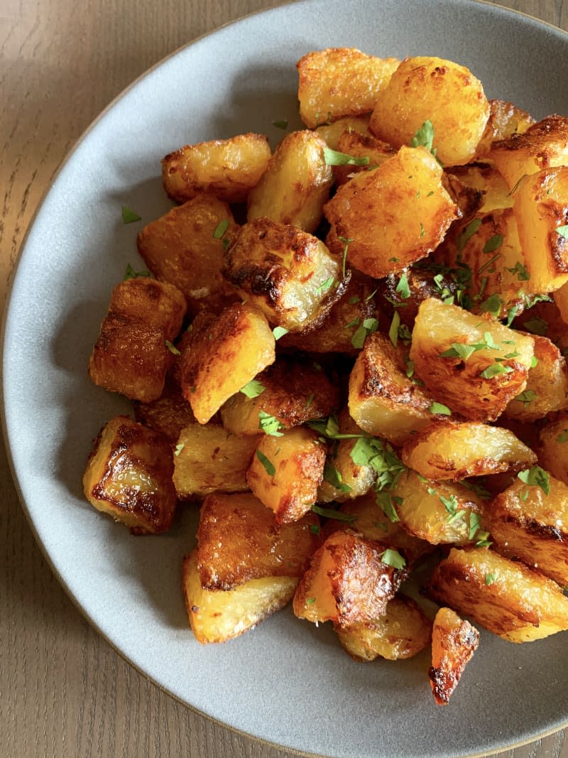 A bowl of roasted potatoes.