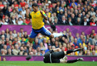 <b>Hulk - Brazil - Soccer - Forward </b> <br> Hulk of Brazil leaps over Alexandr Gutor of Belarus during the Men's Football first round Group C Match between Brazil and Belarus on Day 2 of the London 2012 Olympic Games at Old Trafford on July 29, 2012 in Manchester, England. (Photo by Francis Bompard/Getty Images)