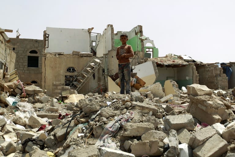 A Yemeni boy stands amidst the rubble of houses destroyed in the Saudi-led air strikes against Shiite Huthi rebels in Sanaa, on May 18, 2015