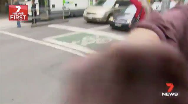 The man punched the camera. Source: 7News
