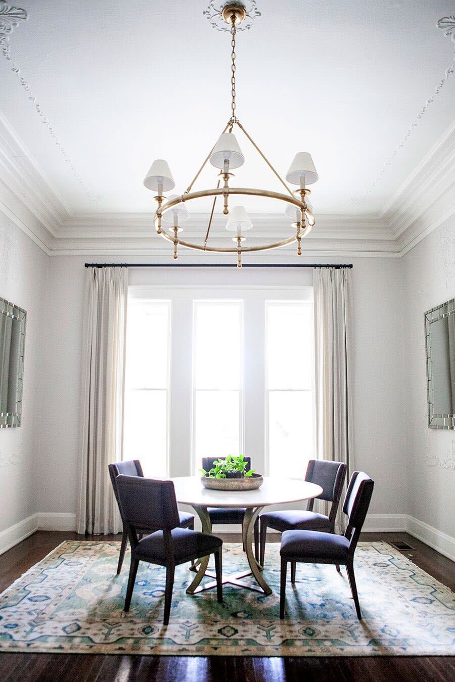 Dining Room with High Ceiling and Round Table