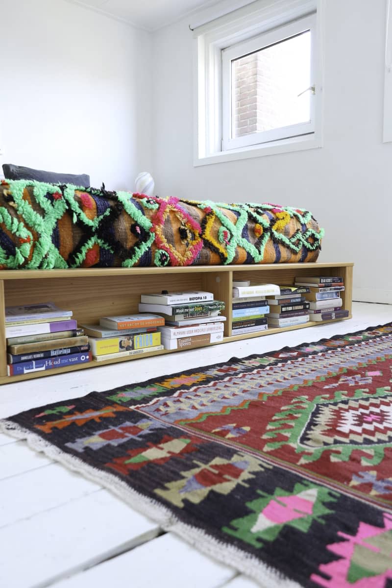 Detail of underbed storage with books