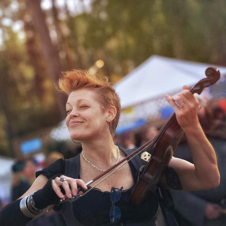 Mama Trish plays violetta at the Hoggetowne Medieval Fair in 2017. She convinced Gainesville city commissioners to fund a pilot project to bring outdoor performers to downtown Gainesville. (Photo by Laurel LaClair Housden)
