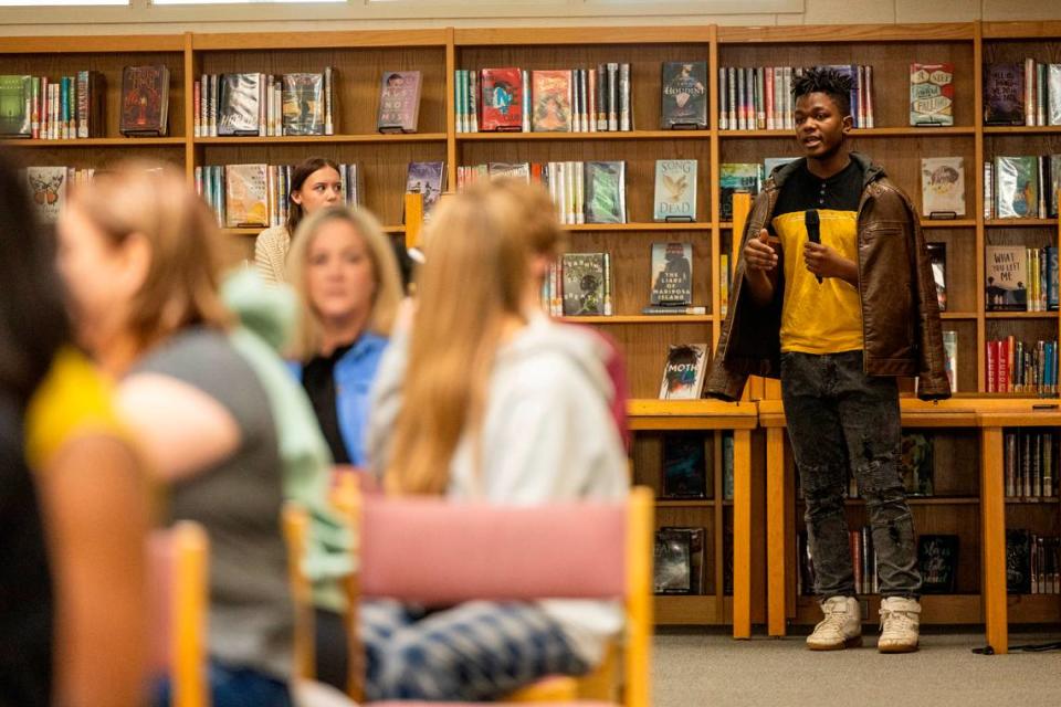 James Cochran, an Athens Drive High School freshman, asks a question during a town hall discussion on the impacts os social media on youth at Athens Drive High in Raleigh on Monday, March 11, 2024. The attorney general’s office and the Wake County school system have both filed lawsuits accusing social media providers of using practices to addict young people to social media.