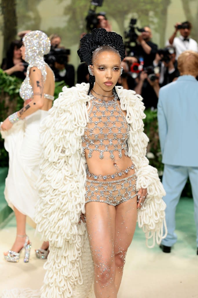 While FKA Twigs deviated from the reigning wet look, she was dripping in crystals. Getty Images for The Met Museum/Vogue