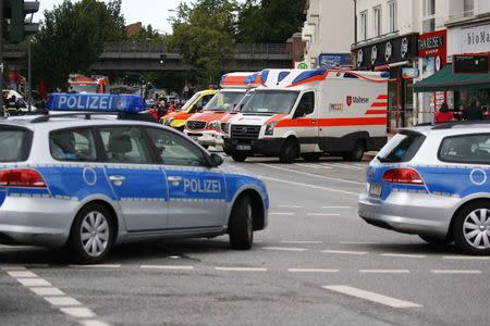 Security forces and ambulances are seen after a knife attack in a supermarket in Hamburg, Germany, July 28, 2017. REUTERS/Morris Mac Matzen