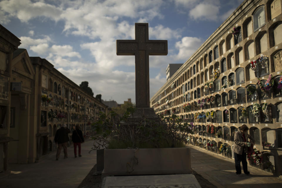 <p>A woman cleans a relative’s grave on All Saints Day, a Catholic holiday to reflect on the saints and deceased relatives, at the Poblenou cemetery in Barcelona, Spain, Wednesday, Nov. 1, 2017. (Photo: Francisco Seco/AP) </p>