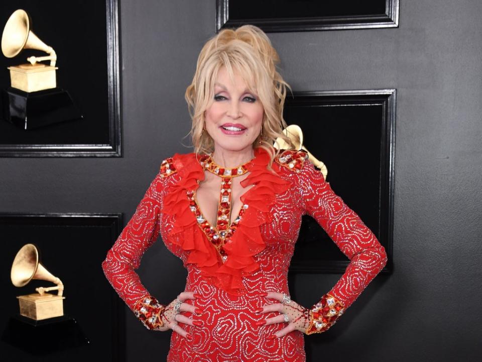 Dolly Parton opens up about tattoo collection (AFP via Getty Images)