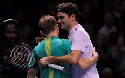 L-R David Goffin and Roger Federer - Credit: Reuters