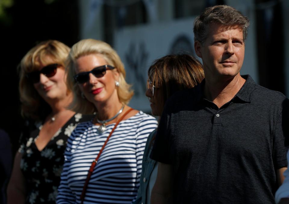 From right, Yankee controlling owner Hal Steinbrenner, his wife Christina DiTullio, Jessica Steinbrenner and Jennifer Steinbrenner Swindal during a private Baseball Clinic in London, Thursday, June 27, 2019. The Yankees are hosting for approximately 100 youth in the London community in conjunction with the London Meteorites Baseball and Softball Club this private Baseball Clinic. (AP Photo/Frank Augstein)