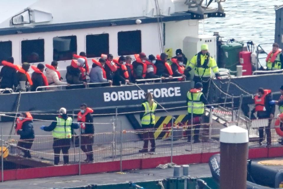 A group of people thought to be migrants are brought in to Dover (PA) (PA Wire)