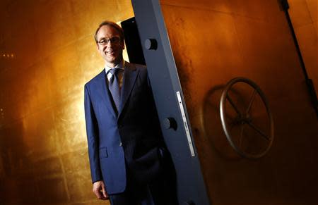 File photo of Germany's federal reserve Bundesbank President Jens Weidmann posing for a photo beside the door of a giant safe at the money museum next to the Bundesbank headquarters in Frankfurt May 17, 2013. REUTERS/Kai Pfaffenbach/Files