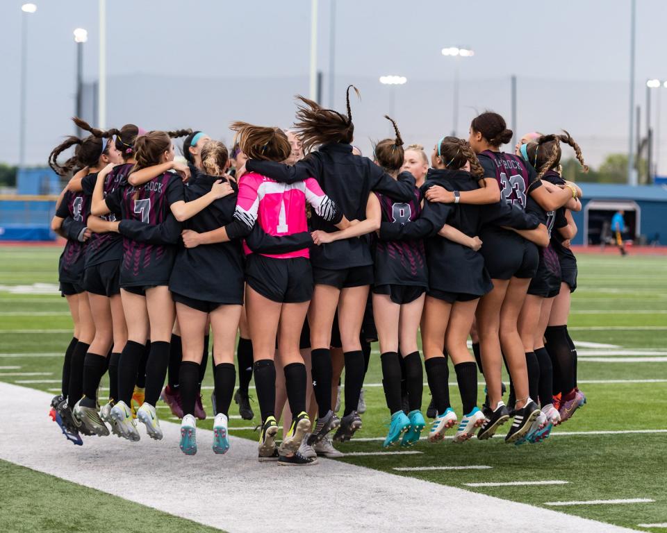 Round Rock players celebrate their 2-0 playoff win over San Antonio Reagan on Tuesday night. The Dragons, who have lost only one match all season, will face Dripping Springs in a Class 6A regional quarterfinal on Saturday.