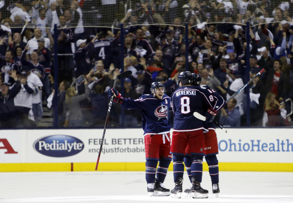 Columbus Blue Jackets players celebrate their goal against the Tampa Bay Lightning during the third period of Game 4 of an NHL hockey first-round playoff series, Tuesday, April 16, 2019, in Columbus, Ohio. The Blue Jackets beat the Lightning 7-3. (AP Photo/Jay LaPrete)