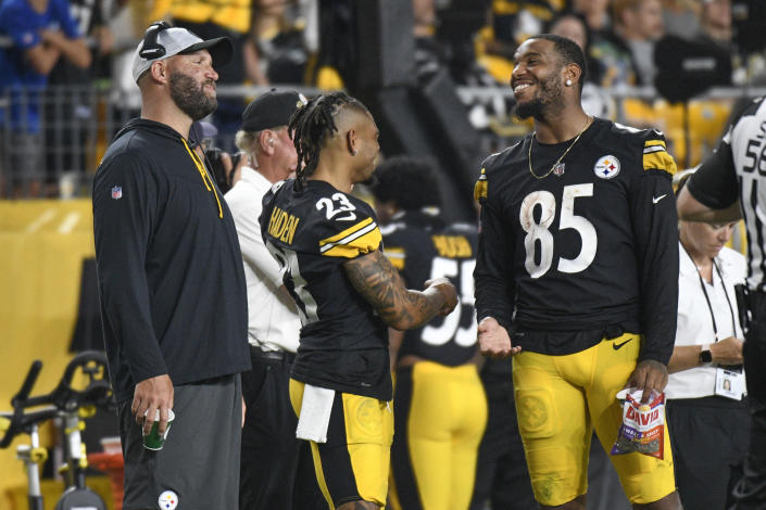 Pittsburgh Steelers quarterback Ben Roethlisberger, left, and tight end Eric Ebron (85) smile on the sideline as the team plays the Detroit Lions during the second half of an NFL preseason football game Saturday, Aug. 21, 2021, in Pittsburgh. (AP Photo/Don Wright)