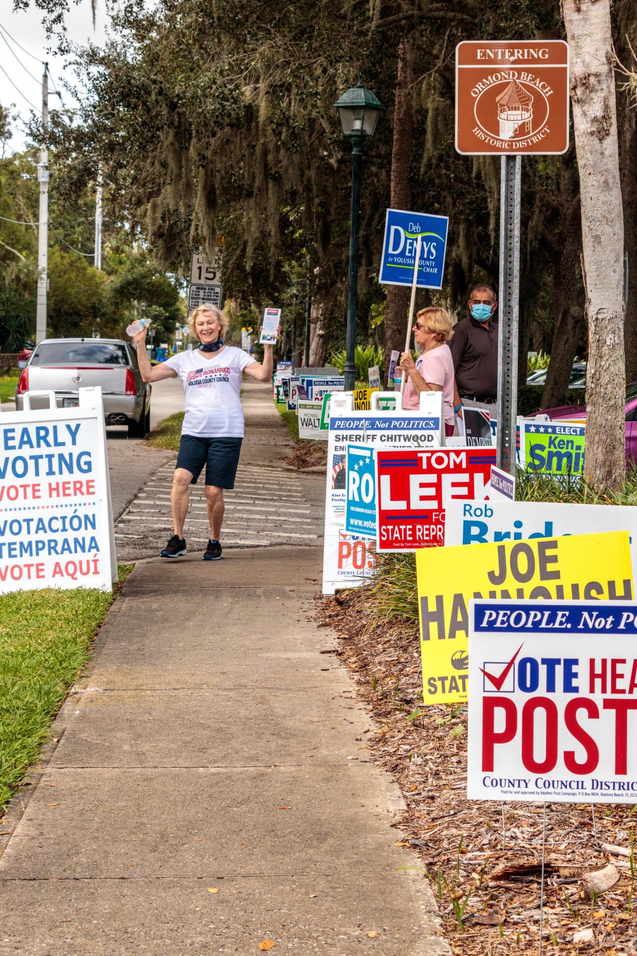 Campaigners make their last-ditch efforts to win over voters outside an early voting location in Ormond Beach in 2020.