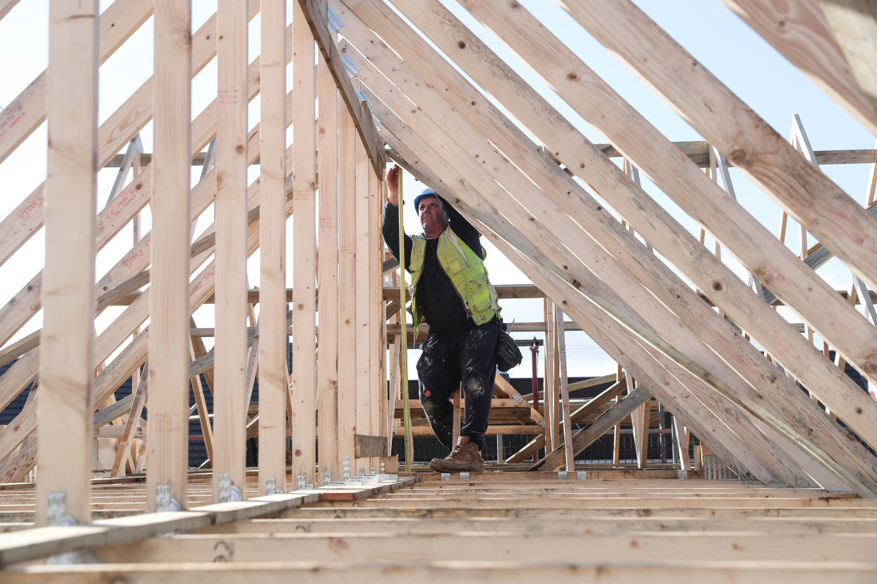 UK economy A builder working for Taylor Wimpey builds a roof on an estate in Aylesbury, Britain, February 7, 2017.  REUTERS/Eddie Keogh