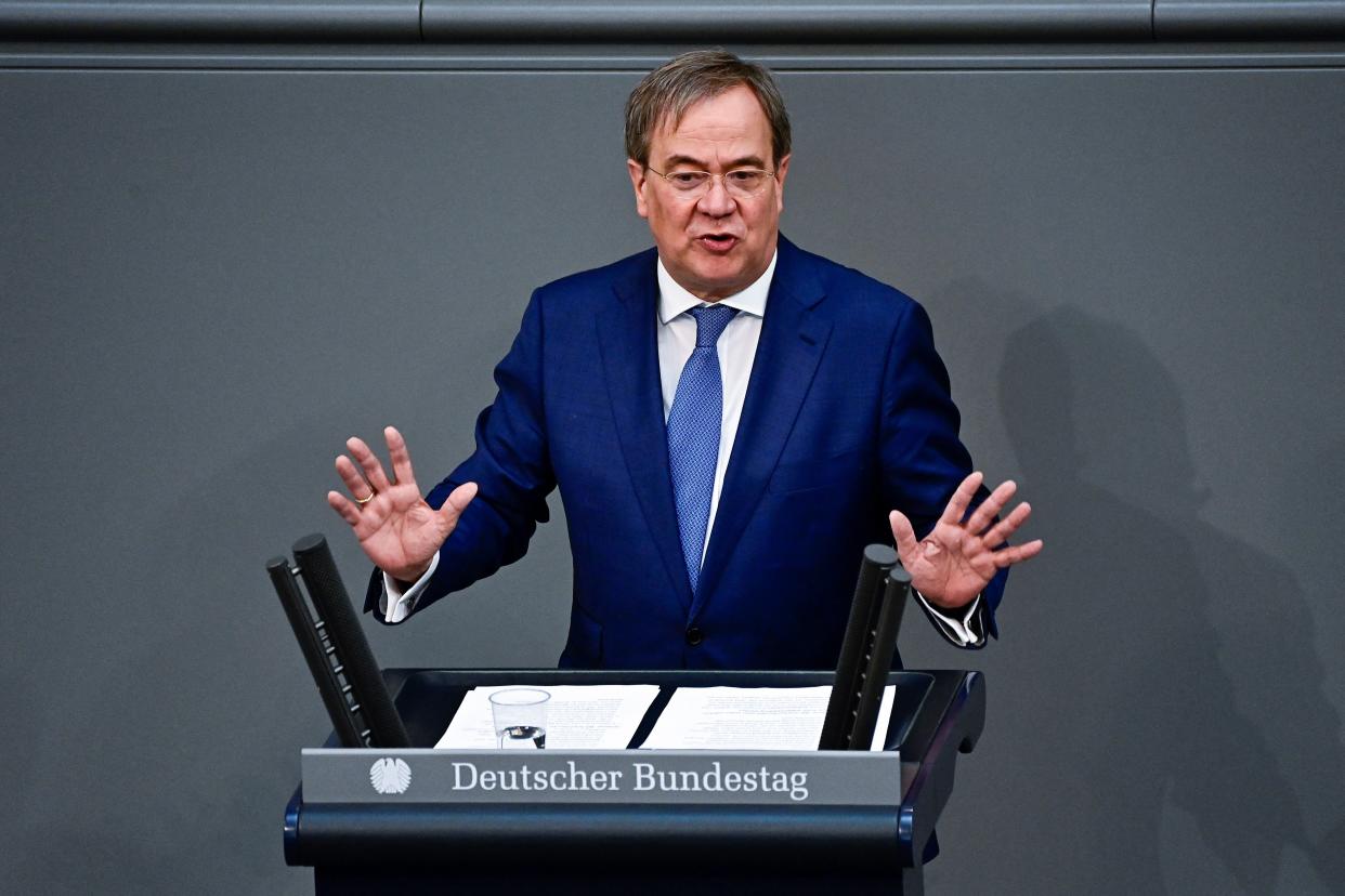 Leader of the Christian Democratic Union (CDU) party and candidate for Chancellor Armin Laschet gestures while addressing the Bundestag (lower house of parliament) in Berlin on June 24, 2021, ahead of an EU summit. (Photo by Tobias SCHWARZ / AFP) (Photo by TOBIAS SCHWARZ/AFP via Getty Images)