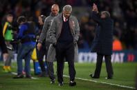 <p>Arsene Wenger bows his head as he leaves the Selhurst Park pitch</p>