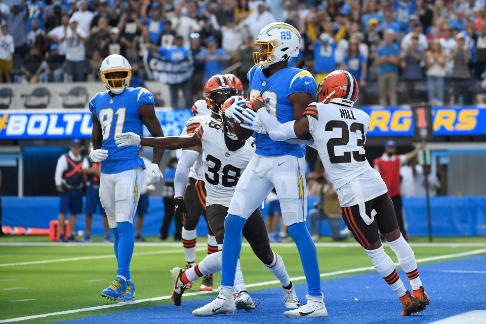 Los Angeles Chargers tight end Donald Parham (89) catches a two-point conversion during the second half of an NFL football game against the Cleveland Browns' Troy Hill (23) Sunday, Oct. 10, 2021, in Inglewood, Calif. (AP Photo/Kevork Djansezian)