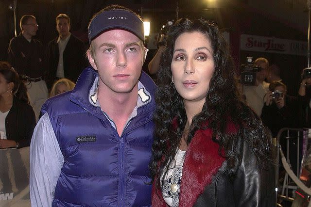 <p>Vince Bucci/Newsmakers/Getty</p> Cher and her son Elijah Blue attend the premiere of the film "Blow" March 29, 2001